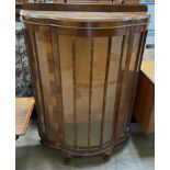 A 20th century walnut display cabinet,