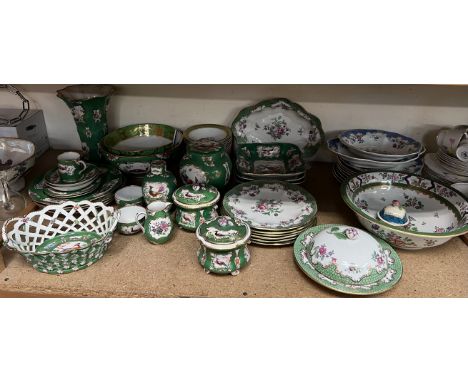 A Booths green scale and floral decorated part dinner set together with a similar ginger jar and cover, tea caddy, chestnut b