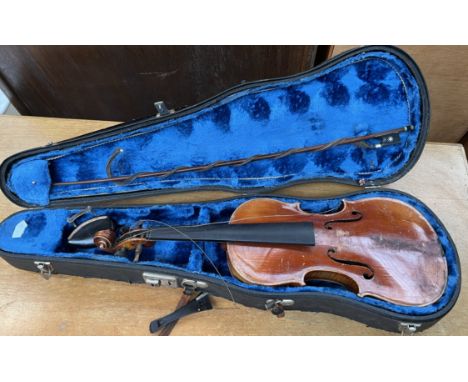 A violin, with a two piece back and ebonised stringing, bears a label for "Antonius Stradivarius, 1736", 55cm long, back incl