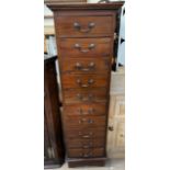 A 20th century mahogany chest with ten drawers on bracket feet