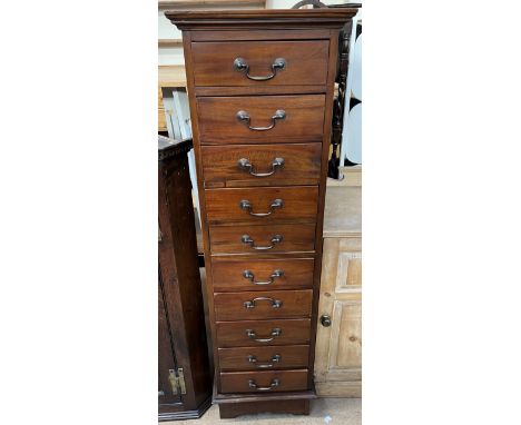 A 20th century mahogany chest with ten drawers on bracket feet