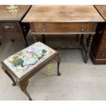 An oak side table with a rectangular planked top above a single drawers on ring turned legs