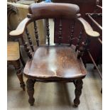 A smoker's bow elbow chair with a spindle back,