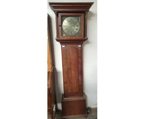 An 18th century oak cased longcase clock, the hood with a  moulded cornice and columns above a long trunk door and box base, 