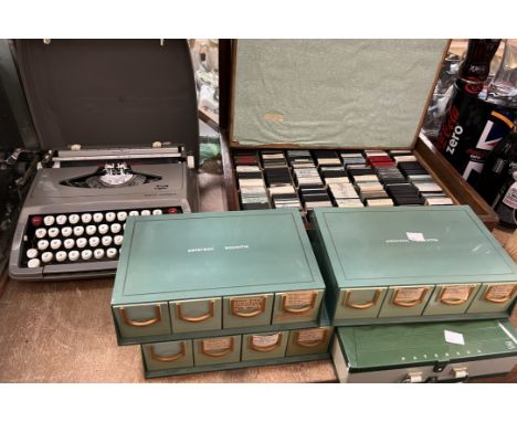 A Smith Corona typewriter together with a collection of photographic slides etc 