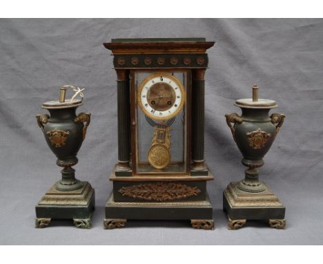 A late 19th century French four glass clock garniture, of architectural form, with a moulded leaf cast plinth held aloft by f