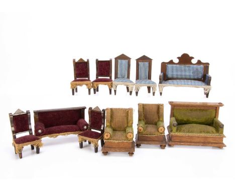 an oak sofa —5in. (13cm.) wide and two arm chairs with green velvet upholstery; a sofa and four chairs with dark red velvet u