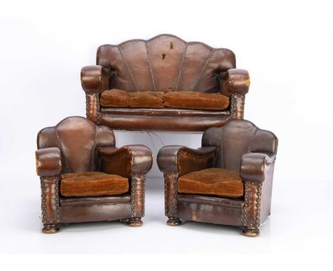 of brown oil-cloth with sun ray backs, brass studs, brown velvet cushions and turned wooden bun feet —19 1/4in. (49cm.) width