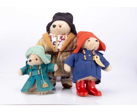 Paddington in his original pyjamas and dressing gown, with back seam label --18in. (46cm.) high; a hand puppet and a smaller 