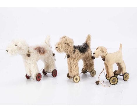 a Lakeland terrier/Airedale with light brown body and black mohair back --7in. (18cm.) long; a white mohair dog with brown ma
