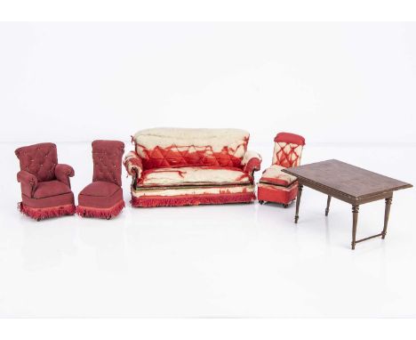 with tinplate frame, remains of original red silk upholstery with fringing, the sofa —9 1/2in. (24cm.) wide, an armchair and 