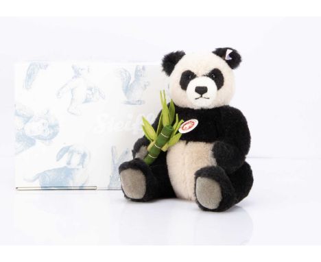 420 of 2008, holding a stick of handmade felt bamboo, in original box with certificate --10 1/4in. (26cm.) high