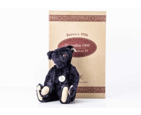 with dark blue mohair, 4733 of 7000 for the year 1998, in original box with certificate --14in. (35cm.) high; and three Steif