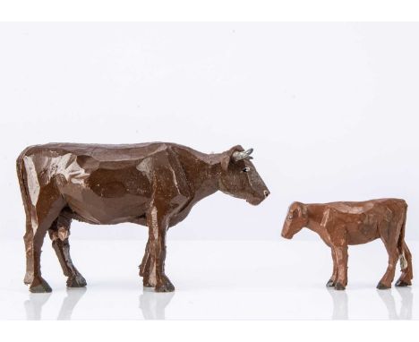 wooden brown standing, lead horns —6in. (15cm.) long and lighter brown calf