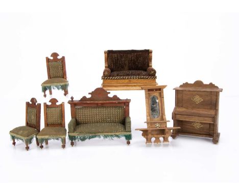 an oak upright piano —5 1/2in (14cm.) high; a hanging mirror with shelf; a sofa with brown velvet upholstery; and sofa and th