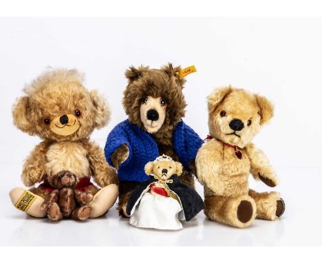 a Steiff yellow tag seated with dark brown mohair, open  mouth --9 3/4in. (25cm.) high; a smaller Steiff bear with remains of