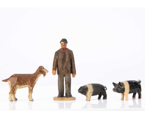 wooden, the man in brown jacket with patch on elbow, grey trousers and grey cap —4 1/2in. (11.5cm.) high (chip to front of ca
