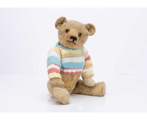 with blond mohair, clear and black glass eyes with painted backs, black stitched nose and mouth, swivel head, jointed limbs, 