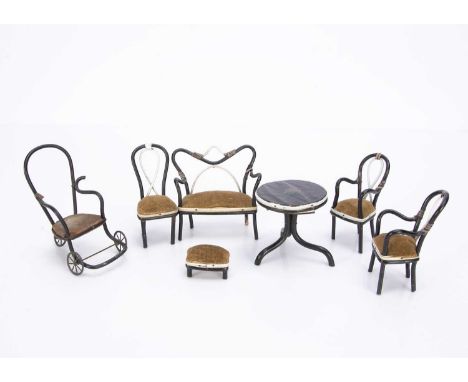 with three cast-cast-metal wheels —4 1/2in. (11.5cm.) high, three similar chairs, sofa, table and foot stool