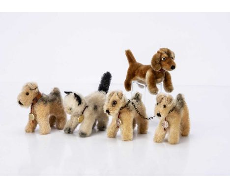 a pair of chained together fox terriers with tags --4in. (10cm.) high; a white and black cat, and a Steiff post war Hexie Dac
