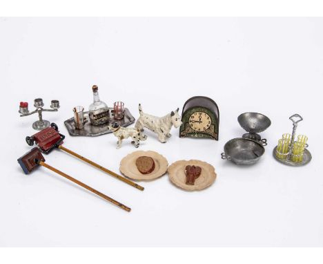 an Anfoe cast-metal carpet sweeper —4 3/4in. (12cm.) high and broom, a tin tray with bottle of Scotch and two glasses, a cast