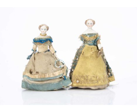 both with blue painted eyes, light brown painted and moulded centre-parted hair in curls, stuffed body with bisque limbs, fla