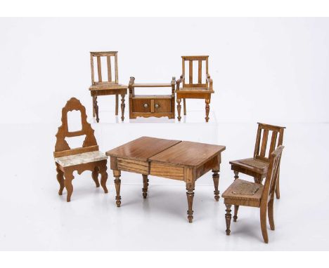 comprising an extending dining table —5 1/4in. (13.5cm.) long (missing leaf, one foot of leg eaten); a hanging shelf with cup