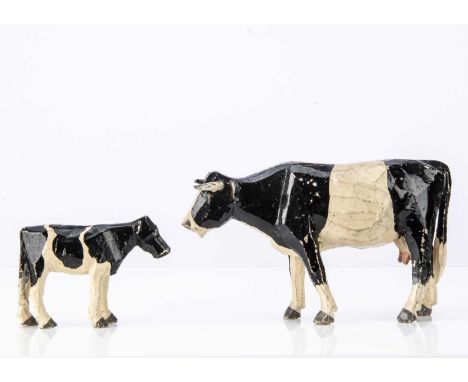 wooden black and white standing, lead horns —6in. (15cm.) long and lighter brown calf