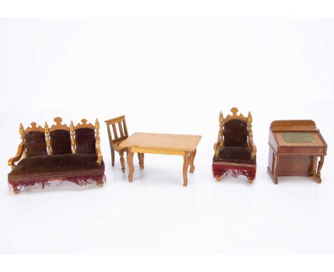 a Gothic revival sofa and armchair with dark red velvet upholstery and fringing —6in. (15cm.) wide, a Davenport desk, a chair