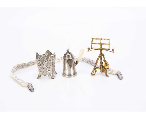 with a lute and clarinet leaning against stand —3in. (7.5cm.) high (missing one foot); a silver plate coffee pepper pot, a pa