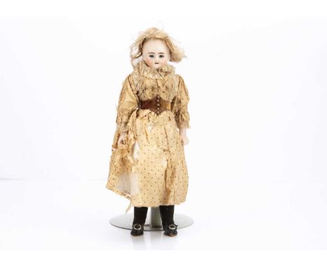 head turned slightly to the right with blue glass eyes, heavy brown brows, open mouth, blonde mohair wig, cloth body with bis