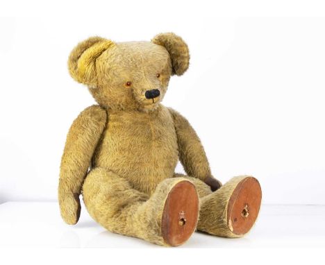 with golden mohair/mix plush, replaced plastic eyes, black stitched nose and mouth, swivel head, jointed limbs with oil-cloth
