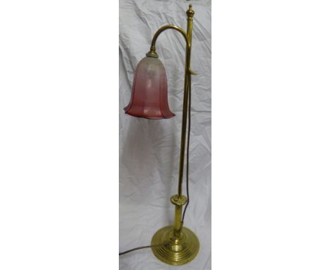 A brass Desk Lamp with etched pink glass shade on an engraved domed circular foot, 30" (76cms) high overall.