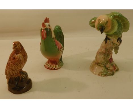 A Beswick Model of a parakeet, no. 930; a Beswick cockerel from the Stylistic Models Series, no. 1001 (cracked), and a Beswic