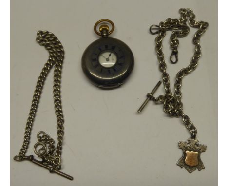 A Half Hunter Fob Watch in engine turned case with enamelled numerals, and a silver Watch Chain and Fob.