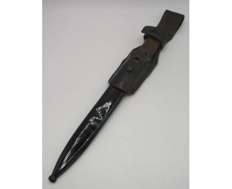 German K98 bayonet with with cut down hilt, stamped WKC to ricasso. Complete with original scabbard and with leather frog. Se