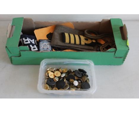 Assortment of military patches from various armed forces, including a WWI Derby Scheme armband, British naval rank insignia, 