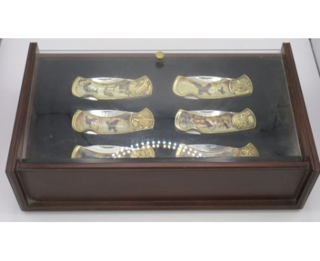 Franklin Mint Wildlife Collector's set of six locking pocket knives, complete with original leather pouches and presented in 