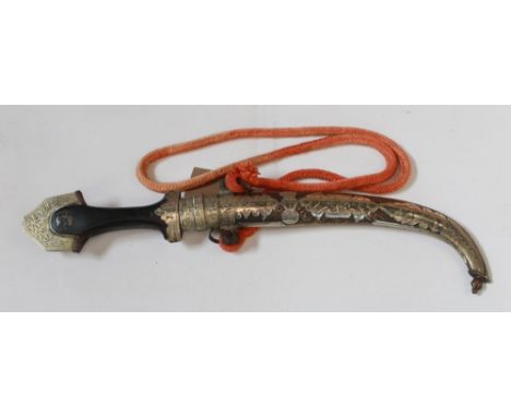 Highly decorative C19th century Moroccan Jambiya dagger, with wooden handle, orange rope tassel, and complete with original s