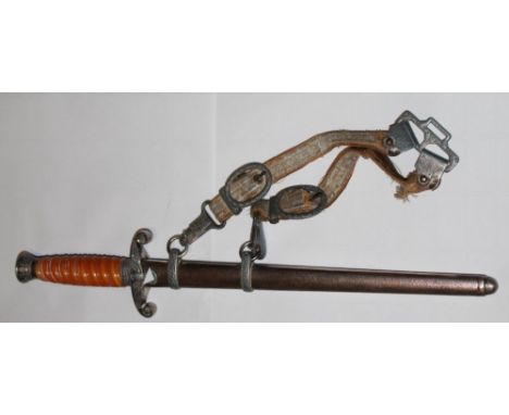 German Army Officers 1935 Dagger. With Celluloid grip and original scabbard and Hanger. Blade stamp is a squirrel holding a s