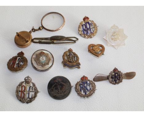 Five Royal Flying Corps silver metal badges, R.F.C. propeller broach, brass R.A.F. tie clip, Naval broach, etc.SHIPPING £33.0