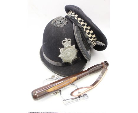 Derbyshire Constabulary police helmet and cap, together with two wooden truncheons and vintage handcuffs. Also with assortmen