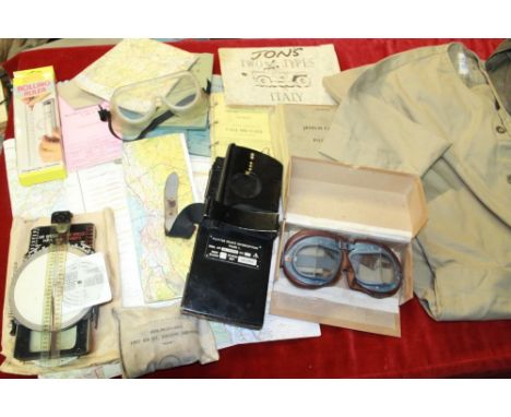 Collection of Military uniforms, maps, pilots goggles, Pilot's Notes, Plotter Pilots Interception Mark 1, Manual Navigational