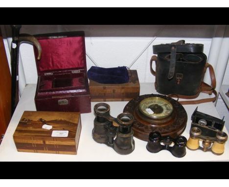 A circular barometer, four pairs of binoculars, various boxes, etc. 