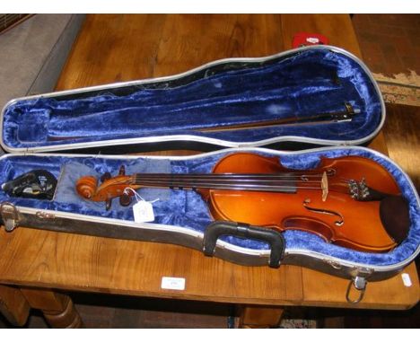 A Cremona violin in carrying case with bow