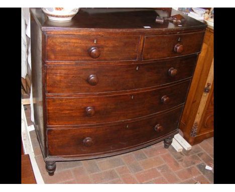 A bow front chest of drawers