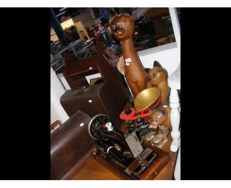 Collectables including carved wooden cats, vintage sewing machine, binoculars, kitchen scales etc.