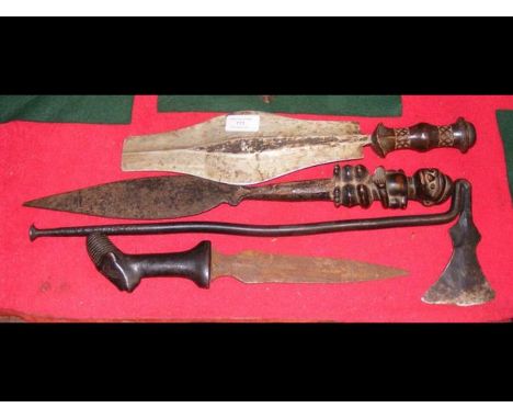 An antique African metal axe, together with three old African edged weapons CONDITION REPORT.