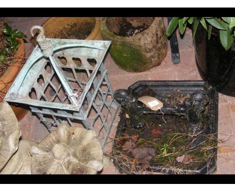 A cast metal foot scraper, together with a porch lantern and two plant pots CONDITION REPORT.