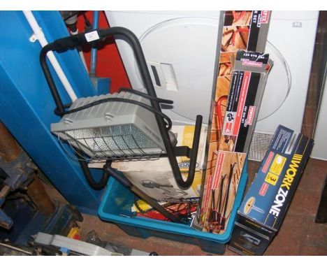 A collection of tools, including a work lamp, crowbar set, etc. 